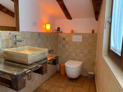 a bathroom with a sink and a toilet at Cal Secretari in Rellinars