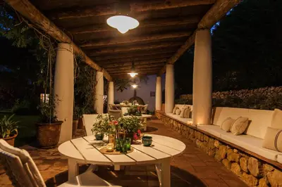 a patio with a table and a couch and chairs at Mas Peirot Sitges in Cunit