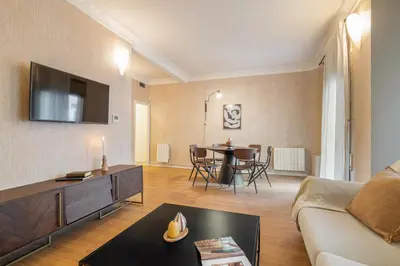 a living room with a couch and a table at Rafael Apartment by Olala Homes in Hospitalet de Llobregat