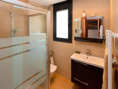 a bathroom with a shower and a sink and a toilet at Apartment Poblenou by Interhome in Barcelona