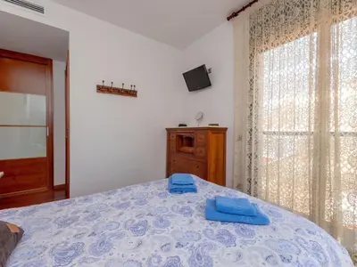 a bedroom with a bed with blue towels on it at Apartment Poblenou by Interhome in Barcelona
