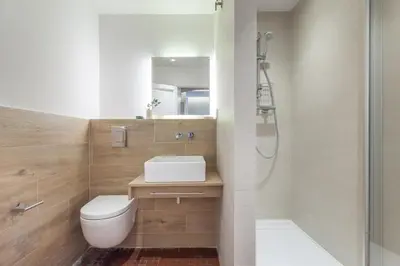 a bathroom with a toilet and a sink and a shower at Flateli Pelayo H5 in Barcelona