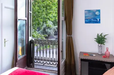 a room with an open door to a balcony at Amra Barcelona Caspe in Barcelona
