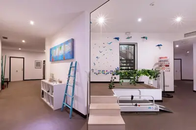 a room with purple walls with a plant and a ladder at Amra Barcelona Caspe in Barcelona