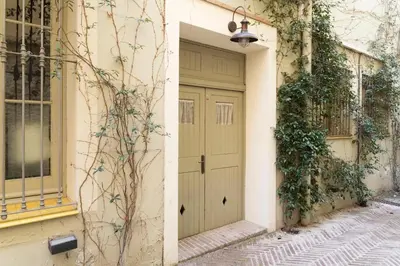 a door on a building next to a street at Romantic In Trendy Gracia in Barcelona