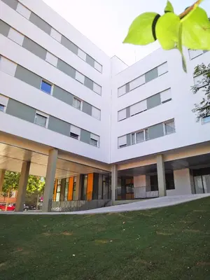 an external view of a white building at Alojamientos Universitarios Resa Hipatia in Terrassa