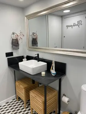 a bathroom with a sink and a mirror at Vive la playa y la noche de Sitges aquí in Sitges
