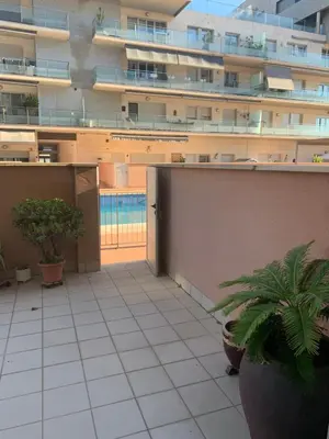 an apartment patio with plants on a building at Badalona Beach Apartment in Badalona