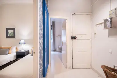 a room with a door leading to a bedroom at Cozy Apartment in the Heart of Gracia, Barcelona in Barcelona