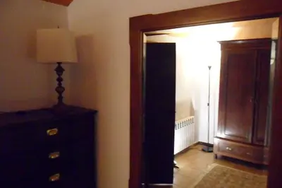 a hallway with a dresser and a lamp in a room at Magic Place in Barcelona