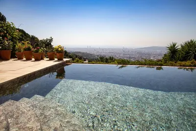 a swimming pool with a view of a city at Magic Place in Barcelona