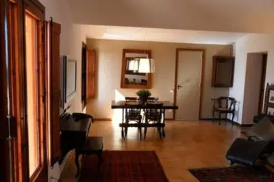 a living room with a table and a dining room at Magic Place in Barcelona