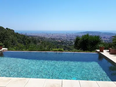 a swimming pool with a view of a city at Magic Place in Barcelona