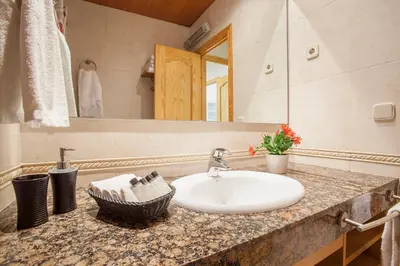 a bathroom with a sink and a mirror at BCNGOTIC 11 in Barcelona