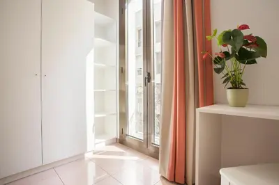 a room with a window and a potted plant at BCNGOTIC 31 in Barcelona