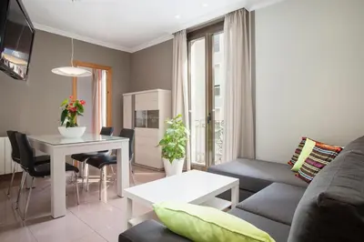 a living room with a couch and a table at BCNGOTIC 31 in Barcelona