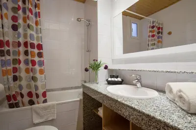 a bathroom with a sink and a toilet and a shower at BCNGOTIC 31 in Barcelona