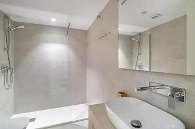 a bathroom with a tub and a sink and a shower at Comtal homey apartments in Barcelona