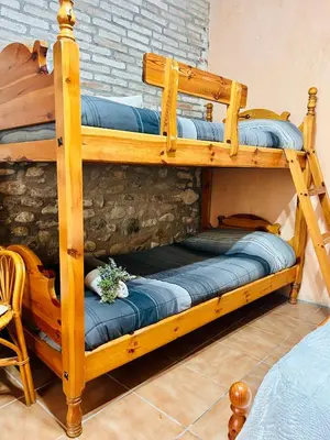 a couple of bunk beds in a room at Masia Pau Prat in Lliçà d'Amunt