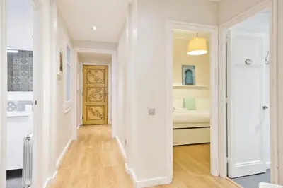a hallway with a door leading to a bathroom at Stay U-nique Apartments Mallorca in Barcelona