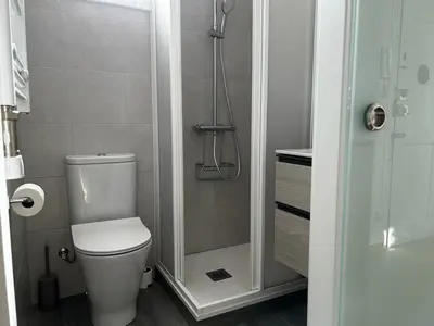 a bathroom with a toilet and a shower at Apartment Sagrada Familia Grassot - Industria by Interhome in Barcelona