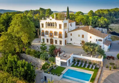 an aerial view of a mansion with a swimming pool at Bolet Casa Modernista in Castellví de la Marca