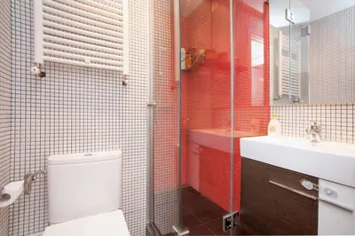 a bathroom with a toilet and a sink at Apartamento Parc Güell in Barcelona