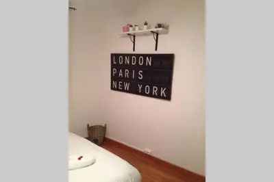 a sign that reads london parts new york on a wall at Apartamento Parc Güell in Barcelona