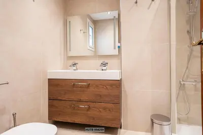 a bathroom with a sink and a shower at Alcam Sant Adria in Sant Adria de Besos