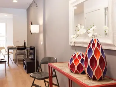 two vases sitting on a table in a living room at Sagrada Familia in Barcelona