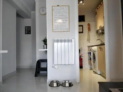 a kitchen with two bowls on the floor of a room at Bonavista Bright Sea View Studio with Balcony in Calella