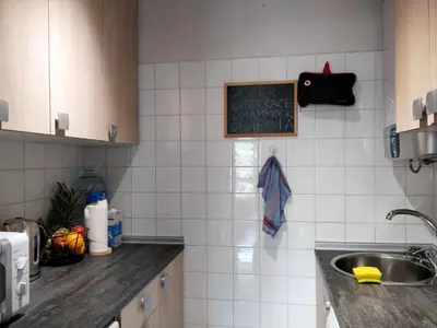 a kitchen with a sink and a chalkboard on the wall at Bonavista Bright Sea View Studio with Balcony in Calella