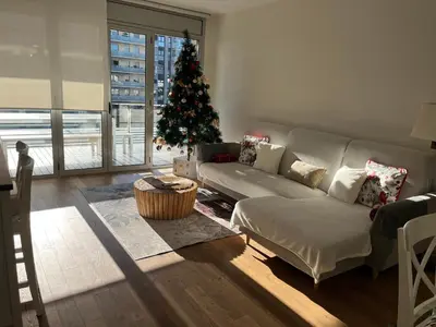 a living room with a christmas tree and a couch at Apartamento Bea Beach in Badalona