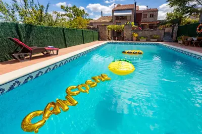 a swimming pool with a sign that says at 8 to 10 Sleeps Private Pool Villa & BBQ Near Barcelona in Rocafort