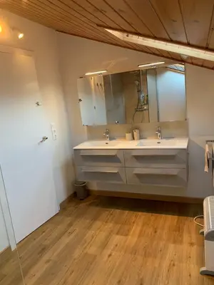 a bathroom with a sink and a mirror at Casa Feliz in Sant Cebrià de Vallalta