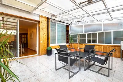a dining room with a table and chairs on a patio at Stay U-nique Apartments Marina in Barcelona