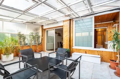 a patio with a black table and chairs at Stay U-nique Apartments Marina in Barcelona