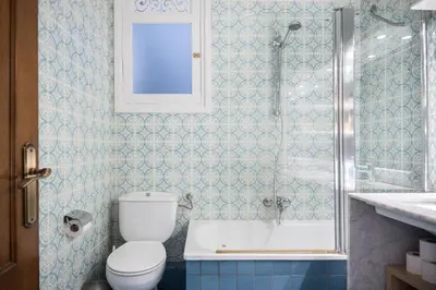 a bathroom with a toilet and a shower and a sink at Spacious 3 bed Apt in the heart of Sant Antoni, Barcelona in Barcelona
