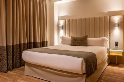 a bedroom with a large bed in a room at Hotel Sansi Barcelona in Barcelona