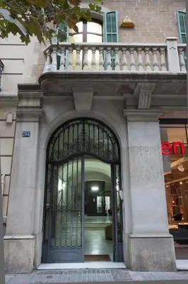 an entrance to a building with a large glass door at B&B Boutique Ca La Maria in Barcelona