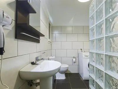 a white bathroom with a sink and a toilet at Be barcelona arco del triunfo sunny colors III in Barcelona
