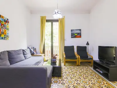 a living room with a couch and two chairs at Be barcelona arco del triunfo sunny colors in Barcelona