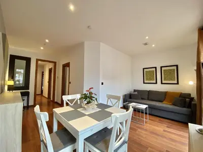 a living room with a table and a couch at Sagrada familia apartment in Barcelona