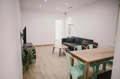 a living room with a couch and a table at BBarcelona Fira Superior Flats in Barcelona