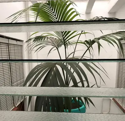 a plant in a pot sitting on a shelf at Hostal Carlos III in El Prat de Llobregat