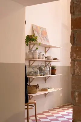 a room with shelves with plants and a chair at CASA FILOMENA in Barcelona