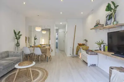 a living room with a couch and a table at Apartment Gaudi in Sitges