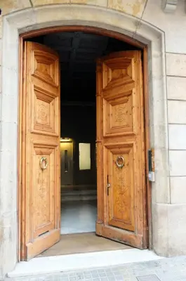 an open wooden door of a building at Fabrizzio's Petit in Barcelona