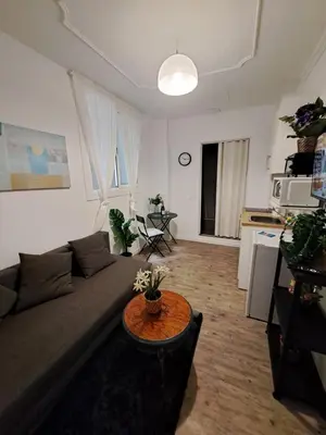 a living room with a couch and a table at Barcelona Central Apartments in Barcelona