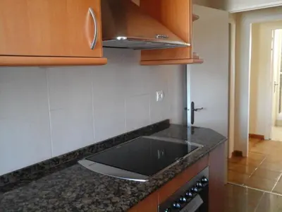 a kitchen with a sink and a counter top at Atico Soleado Vistas panoramicas in Hospitalet de Llobregat